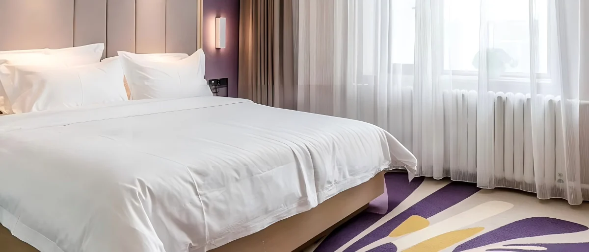 Coordinated hotel bedding prepared for a Funihe customization program