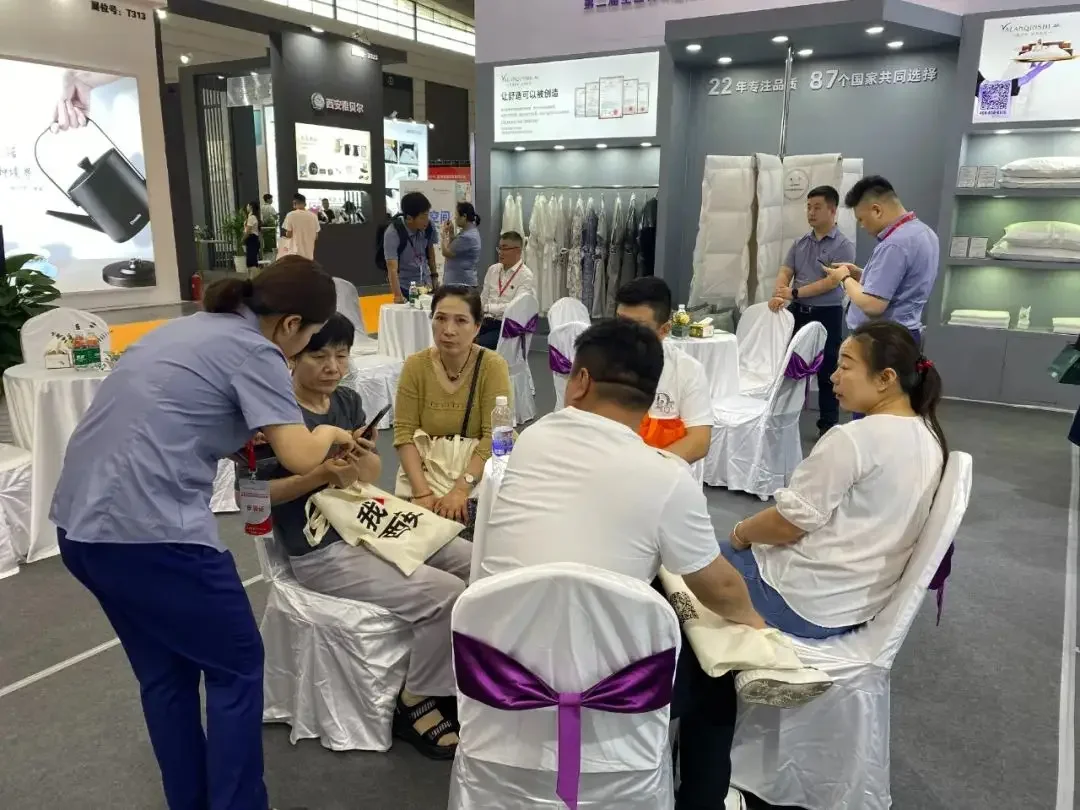 Funihe team and hospitality textile buyers at exhibition 3