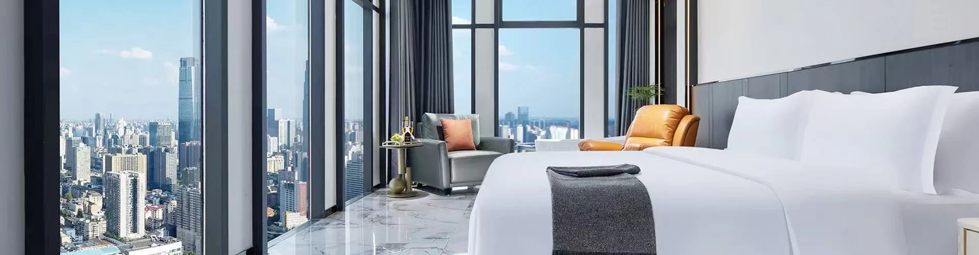Premium hotel room with white bedding and a city view